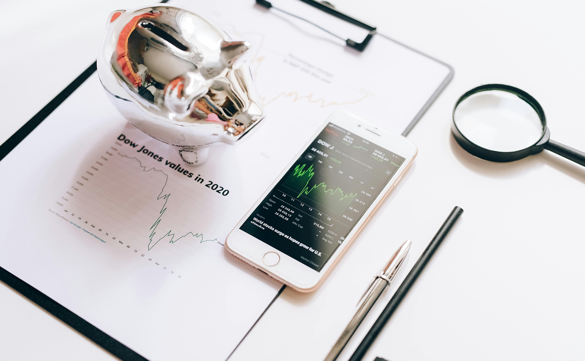 Investment strategies image if piggy bank and cell phone